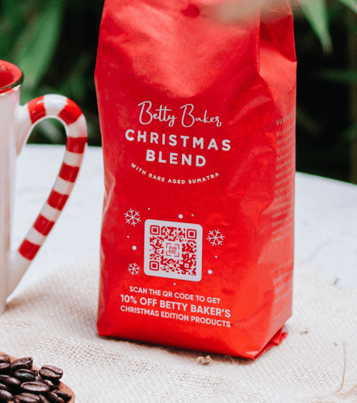 QR Code on christmas coffee blend packaging offering a discount coupon.